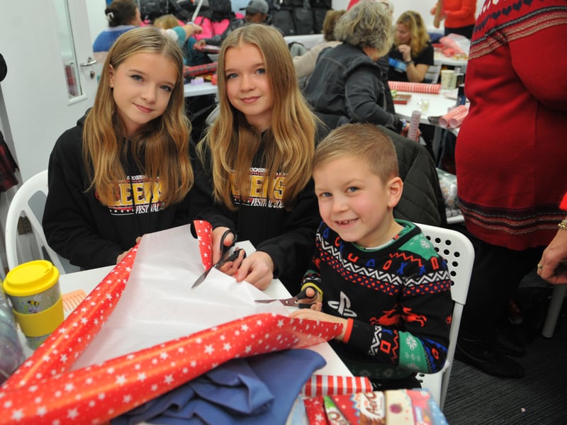 Santa's little helpers, Elise Mackay, 12, Leah Mackay, 12 and Rio Mackay-O'Rourke, six, help out.