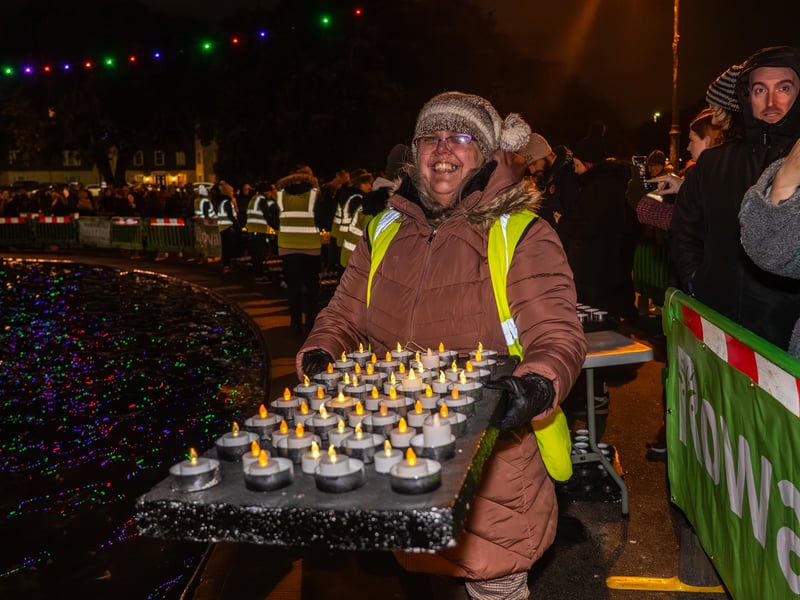Lake of Lights by Rowans Hospice at Canoe Lake in Southsea. Pictured is a Rowan's Hospice Volunteer taking candles to the lake to be placed in. Pictured by Alec Chapman