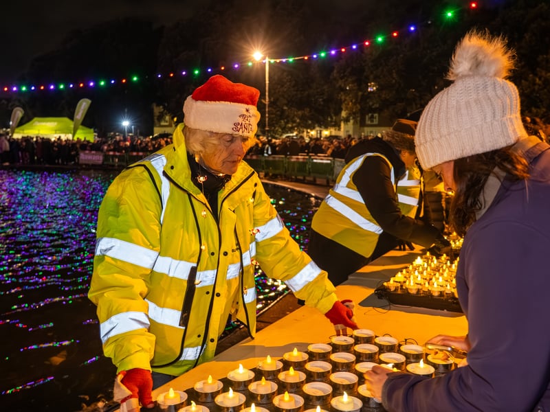 Lake of Lights by Rowans Hospice at Canoe Lake in Southsea. Pictured is a Rowan's Hospice Volunteer. Pictured by Alec Chapman