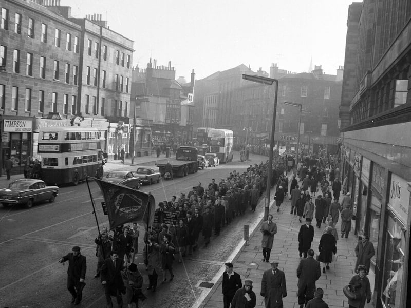 Striking ship building and engineering union members march along Lothian Road in February 1962.