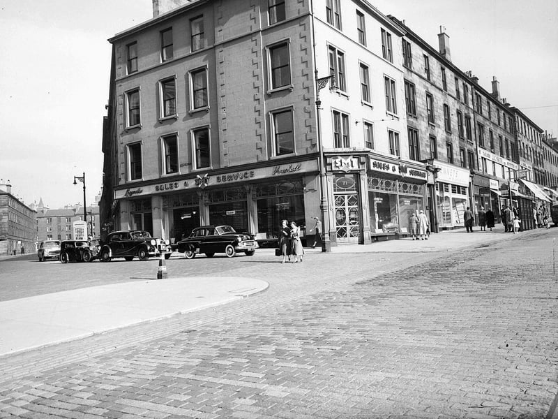 The SMT motor car showroom at the corner of Lothian Road and Grindlay Place in June 1956.