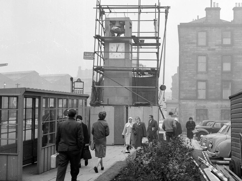 A clock presented to Edinburgh by A Bell & Sons nears completion in Lothian Road in December 1962.