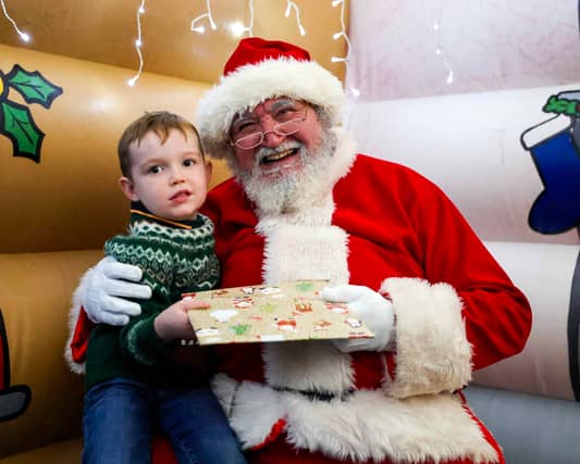 Christmas magic at HMS Sultan: Father Christmas greets delighted children at the naval engineering base, bringing festive joy to military families.