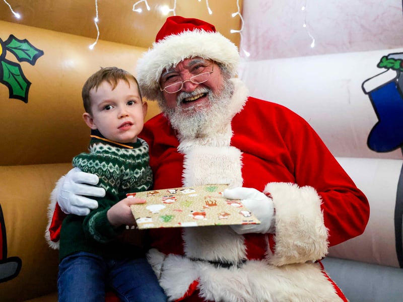 Christmas magic at HMS Sultan: Father Christmas greets delighted children at the naval engineering base, bringing festive joy to military families.