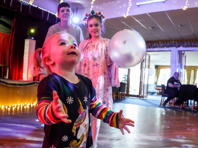 Dancing the day away: Children enjoy music from the DJ at HMS Sultan's Christmas celebration.