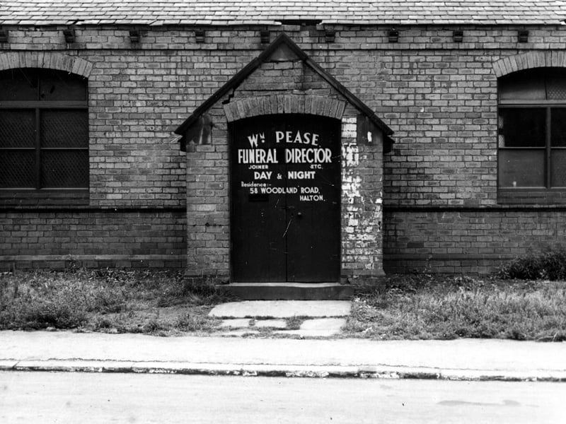 The workshop of W.M. Pease, joiner and funeral director. The notice on the front door gives his residence as 58 Woodland Road. Pictured in August 1944.