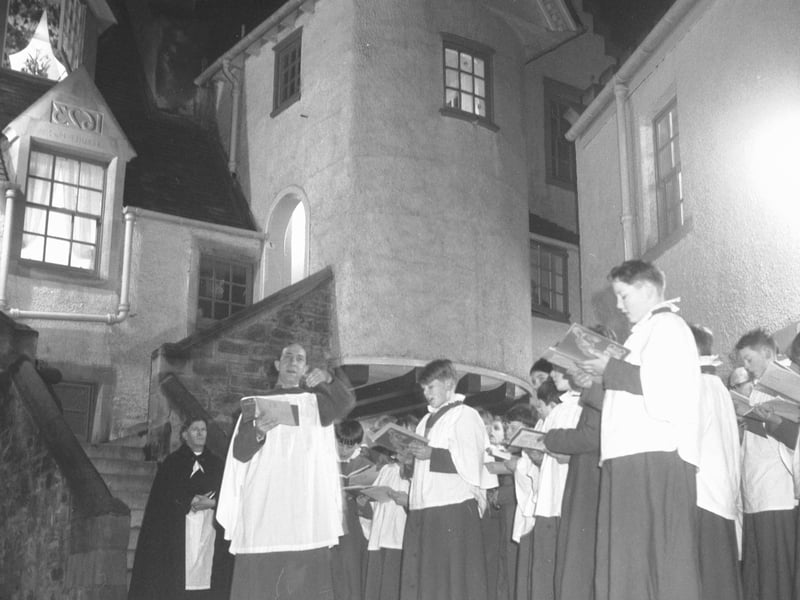 Choirboys from St Mary's Cathedral sing Christmas carols in Whitehorse Close in 1965.