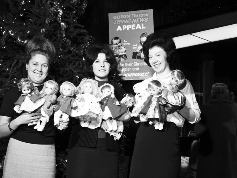 Evening News & Dispatch employees with some of the dolls in the Christmas gift scheme in December 1965.