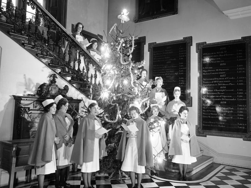 Nurses singing Christmas carols round the Christmas tree at the Edinburgh Royal Infirmary in 1965.
