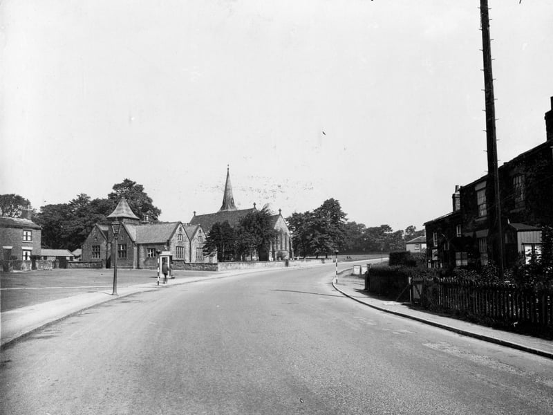 York Road passing through Seacroft in June 1936.. St. James' school and church are on the left. Constructed of Roundhay stone by Benjamin Russell of Leeds, the church cost £3,174.