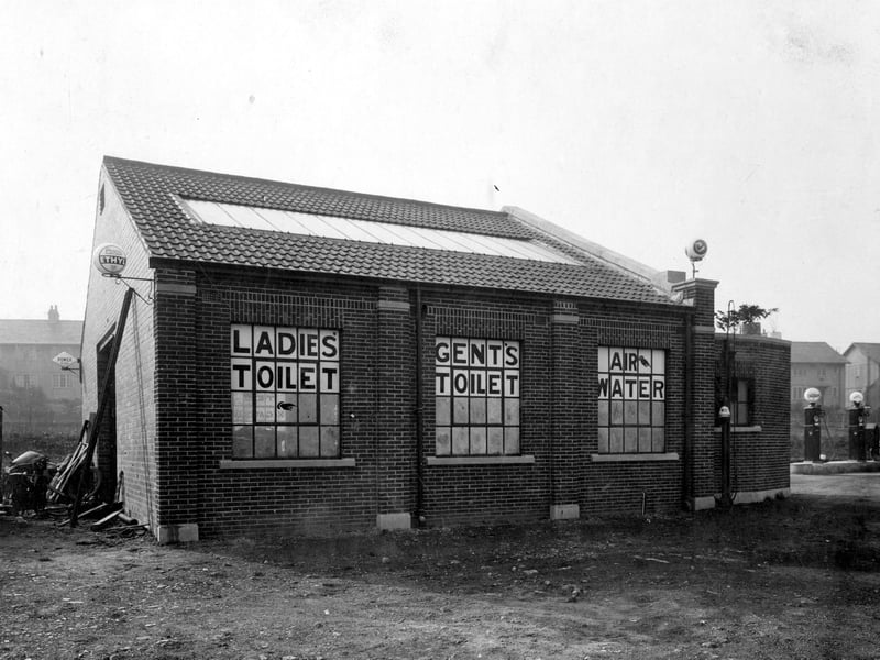 Seacroft Garage off York Road. Shows rear view with signs for Ladies toilet, Gents toilet + Air + Water. Pictured in September 1932.