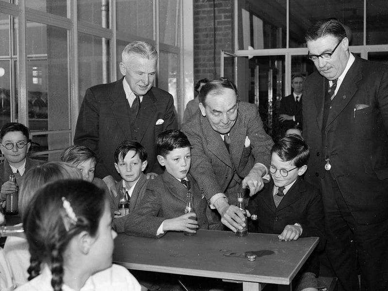 Undersecretary of State for Scotland Mr J Henderson Stewart and some pupils at the new Oxgangs Primary School in March 1956.