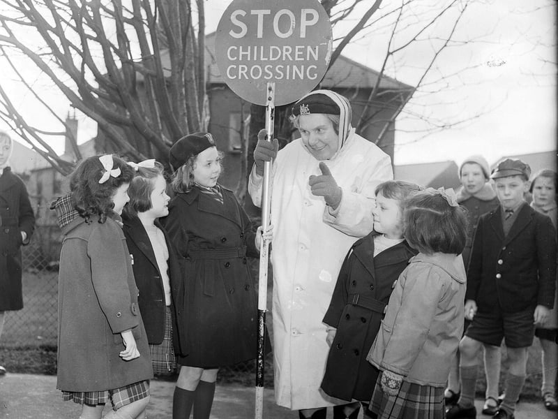Mollie Harris  helping children cross the road in Oxgangs in February 1962.
