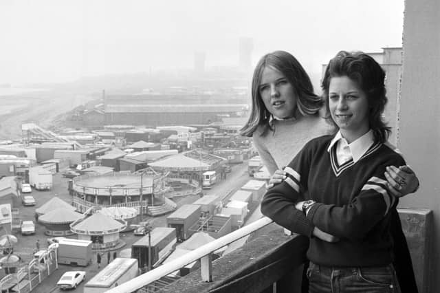 View of the Links market and funfair at Kirkcaldy, Fife, in April 1974. High-rise flats residents Jacqueline and Eileen enjoy the market for free.
