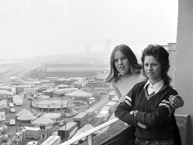 View of the Links market and funfair at Kirkcaldy, Fife, in April 1974. High-rise flats residents Jacqueline and Eileen enjoy the market for free.