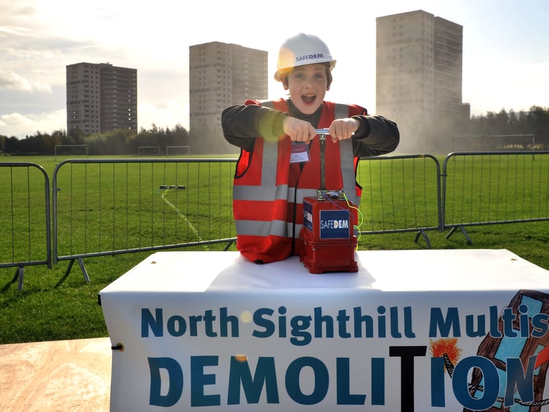Three tower blocks in Sighthill, Edinburgh, are demolished as part of the City of Edinburgh Council's regeneration plans for the capital. Pictured is Lewis Reynolds, aged nine, who helped push the plunger in September 2011