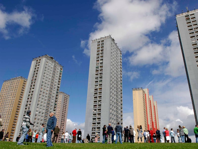 Crowds look up as high-wire artist Didier Pasquette attempts to walk between Glasgow's Red Road tower blocks, 90 metres above the ground. Due to winds and problems with the wire tension, he only managed to walk a few steps before turning back in July 2007.