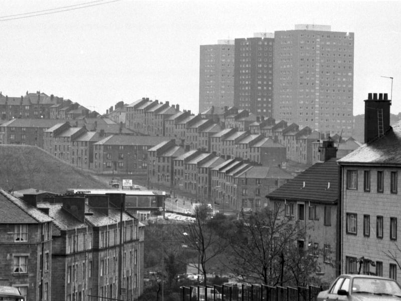Old tenements in Glasgow being dwarfed by high-rise flats in October 1989