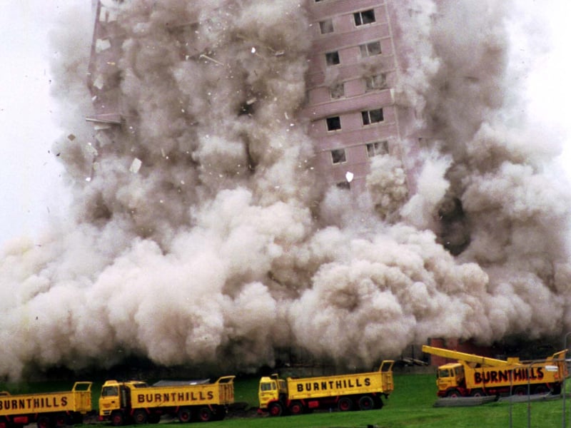 Explosives go off and a multi-storey block of flats at Coll Place in the Germiston area of Glasgow is demolished in October 1992