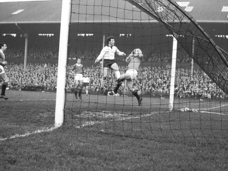 Eddie O'Donnell challenges goalkeeper Billy Ritchie during a Hearts v Rangers at Tynecastle in November 1965. 