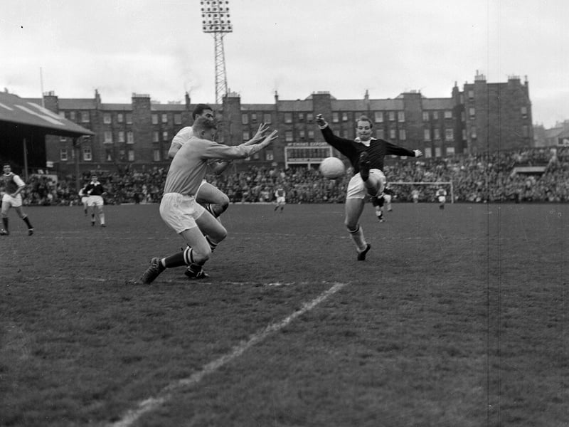 Hibs' goalkeeper Willie Wilson saves during a match against Hearts at Tynecastle in May 1964.