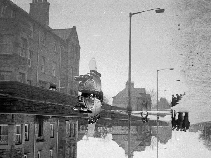 A burst water mains causing flooding to homes and streets in Gorgie in March 1963.