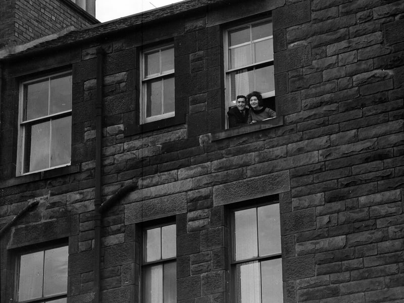 Danny Paton and his wife Sandra look down on Tynecastle football ground from the window of their Gorgie Road home in December 1962.