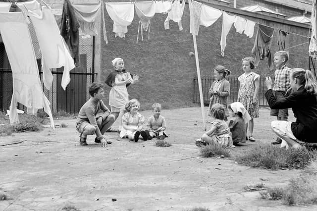 Children playing in a backgreen in Gorgie in August 1957.