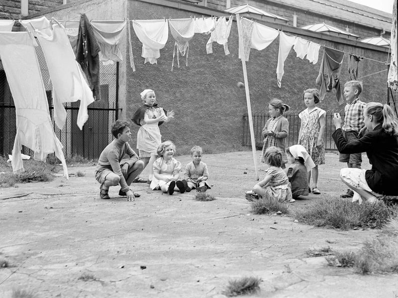 Children playing in a backgreen in Gorgie in August 1957.