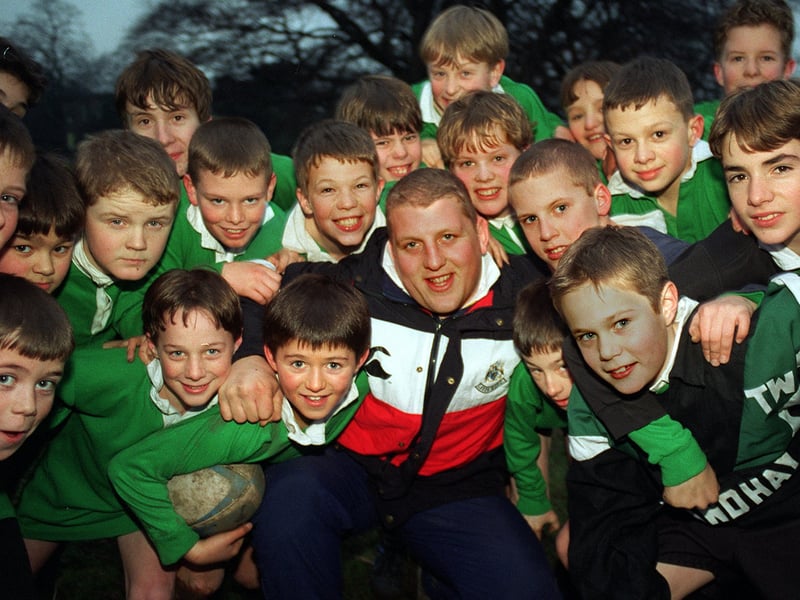 Leeds Rugby Union player Mike Shelley is pictured with pupils from Roundhay High during a training session at the school.