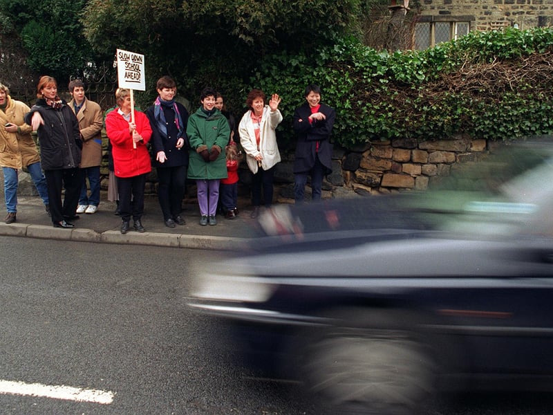 January 1997 and parents encourage drivers to slow down outside Hawksworth Primary after a recent accident outside the school.