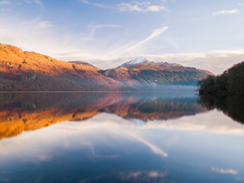 As Scotland's largest loch by surface area, Loch Lomond ranks fourth with an impressive 639,000 Instagram hashtags, making it a classic proposal setting. Located within the Loch Lomond and The Trossachs National Park, it provides stunning views of the waterfront framed by rolling hills and mountains. With over 30 islands dotting the water, along with numerous beaches and charming villages along its shores, you'll find plenty of scenic spots to choose from. The area offers a wide range of accessible viewpoints for large-scale proposals, as well as more secluded locations for a private celebration.