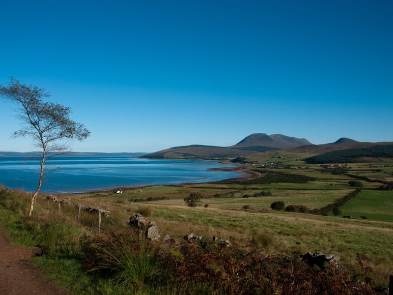 Often called "Scotland in miniature," the Isle of Arran has earned 165,000 Instagram hashtags by offering an incredible variety of landscapes within a small area. Easily reachable via a short ferry ride from the mainland, Arran has everything from mountains and glens to beaches and picturesque villages. If you and your partner don't mind a climb, Goat Fell, the island's highest peak, provides spectacular summit views, while the coastal areas offer gentler walks.