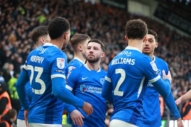 Pompey players celebrate Callum Lang's opener.