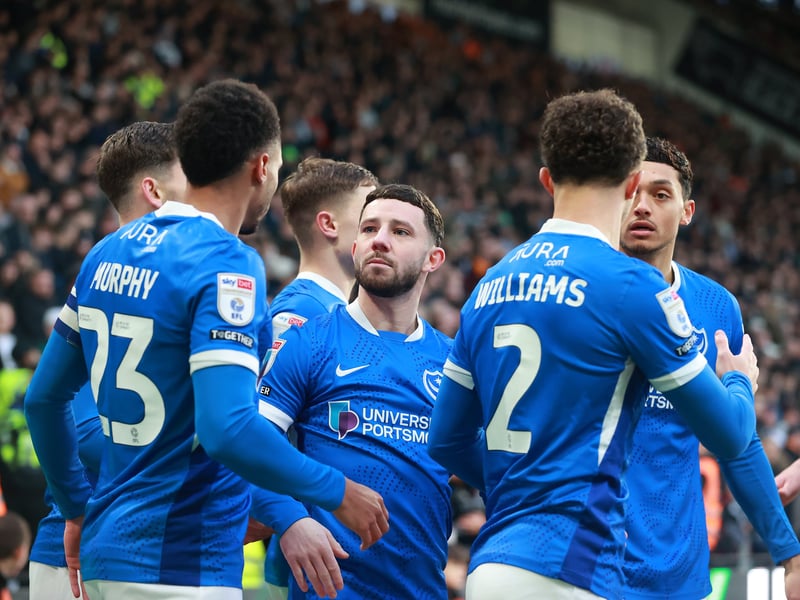 The Pompey players celebrate in front of the travelling Fratton faithful.