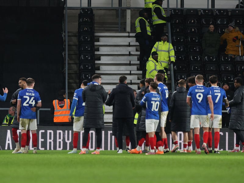 John Mousinho's men applaud the travelling Fratton faithful at full time.