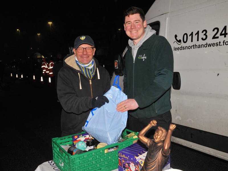 Dave Hay, of Cookridge, hands over some food to Spike Hardy of Leeds North and West Foodbank.