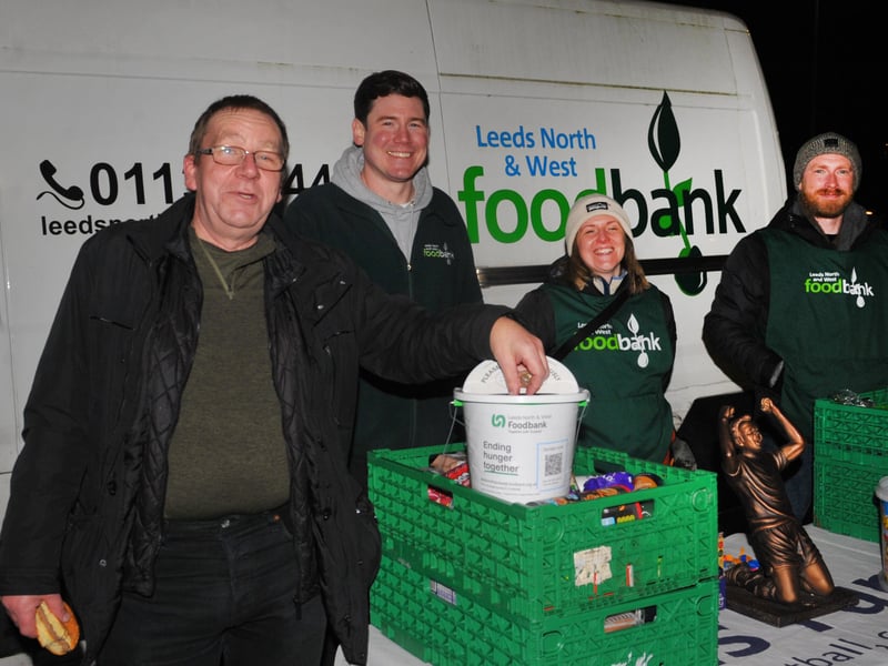 Alan Sydkowski donates looking on are Spike Hardy of Leeds North and West Foodbank and volunteers Jess Harrison-Prince and Rob Hepworth.