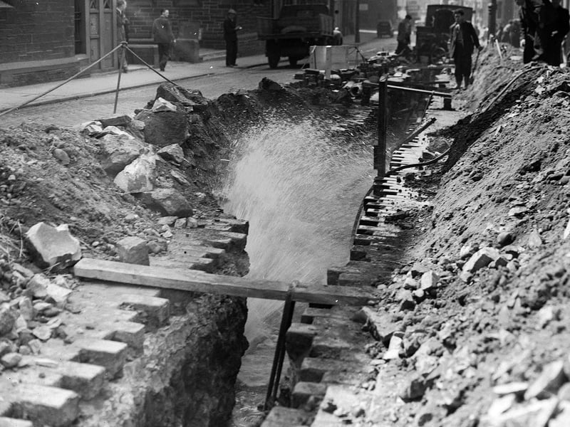 A burst water main in Fountainbridge in May 1955.