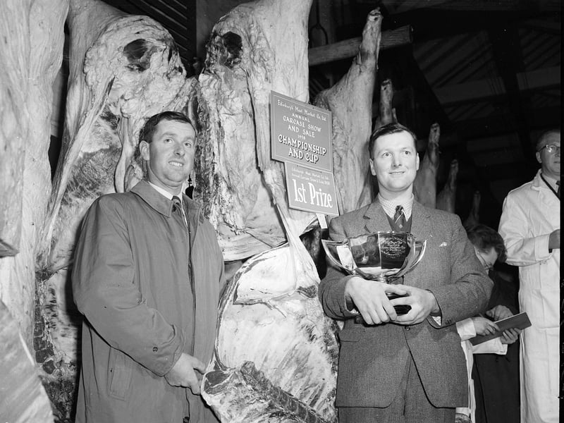 Winners at the Carcass Show and Sale at the Edinburgh Meat Market at the corner of Semple Street and Fountainbridge in December 1958. James and David Runciman are pictured with the first prize cup.