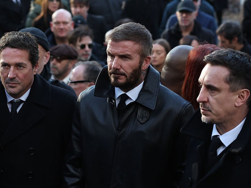 Sir David Beckham and Gary Neville at the funeral.