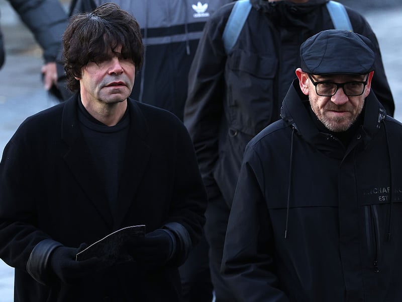 The Smiths drummer Mike Joyce arrives alongside Charlitans frontman Tim Burgess.