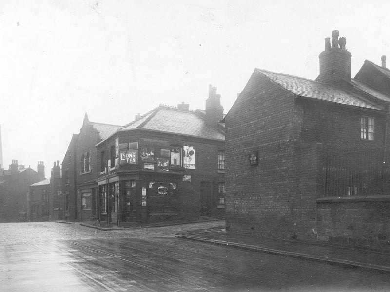 The junction of Mabgate with New Church Place. Shop on corner is property of Mrs Rose Ann Smith. This view from November 1929 is looking up Mabgate, the chimney of the Hope foundry is visible in the distance.