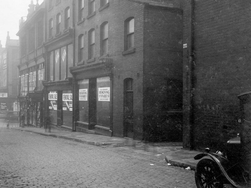 Mark Lane looking towards New Briggate in November 1929. Greenhills Taylors on corner with the empty premises formerly J & H Smith, Ironmongers to the right. Next is W. A. Homburg, theatrical costumer.