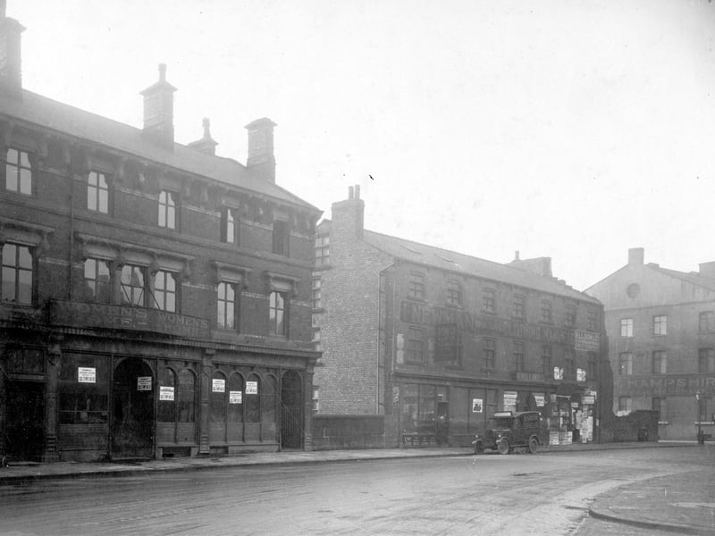 On the right is number 54 Lady Lane, previously premises of the Women's lodging house; notices in the window inform that its new premises are at 121 Templar Street. The wall next to this marks the channel of the Lady Beck which has been covered to run underground here; Lady Bridge is situated just behind the wall. Pictured in November 1929.