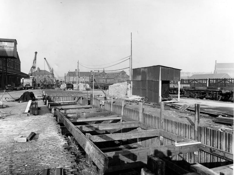 Work in progress on a sewer in Hunslet Goods Depot on South Accommodation Road. In the foreground is a trench shored up with wooden beams and corrugated iron. Pictured in November 1950.