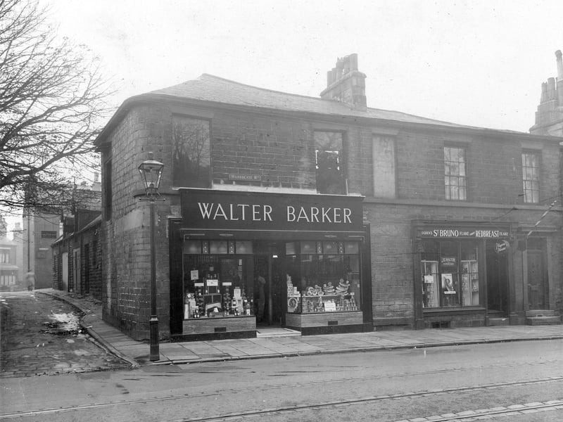Walter Barker grocers at number 194 Harrogate Road. The shop front is divided into two with, among other things, plums and boxes of cornflakes in the left window and eggs in the right. Short Lane is to the far left. Number 192 is Nelly Bolton hairdresser. Pictured in October 1935.