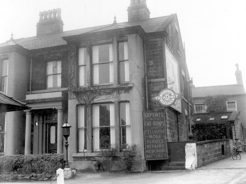 Advertising sign for Trapps Garage, no 53 Harrogate Road, which is with the junction of Stainbeck Lane. The garage is out of shot in this view, to the left. The sign reads 'Experts with car bumps and cellulose work, service, repairs, reboring, batteries.' Pictured in November 1939.