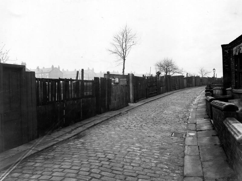 Looking north east along Back Cross Green Crescent in November 1950. Houses on the Glencoe streets can be seen in the background.