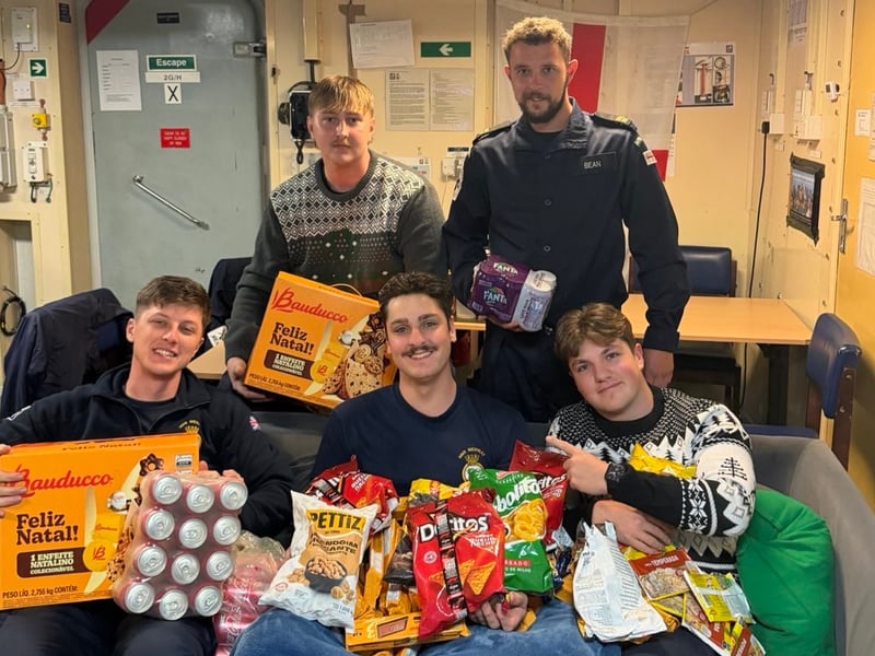 Royal Navy sailors aboard HMS Medway receiving donations from the RNRMC and spreading Christmas cheer.